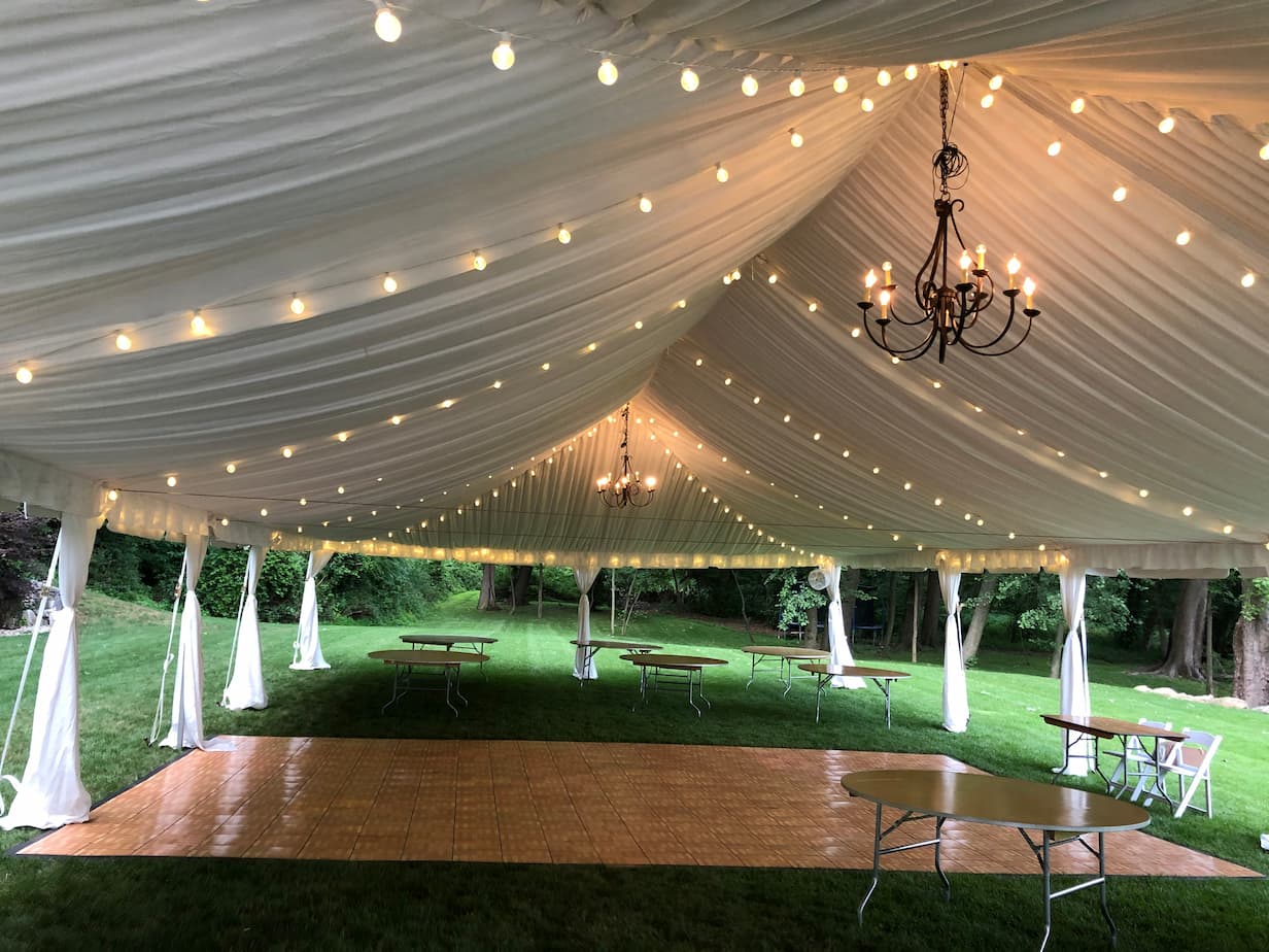 a wedding tent, with lights underneath