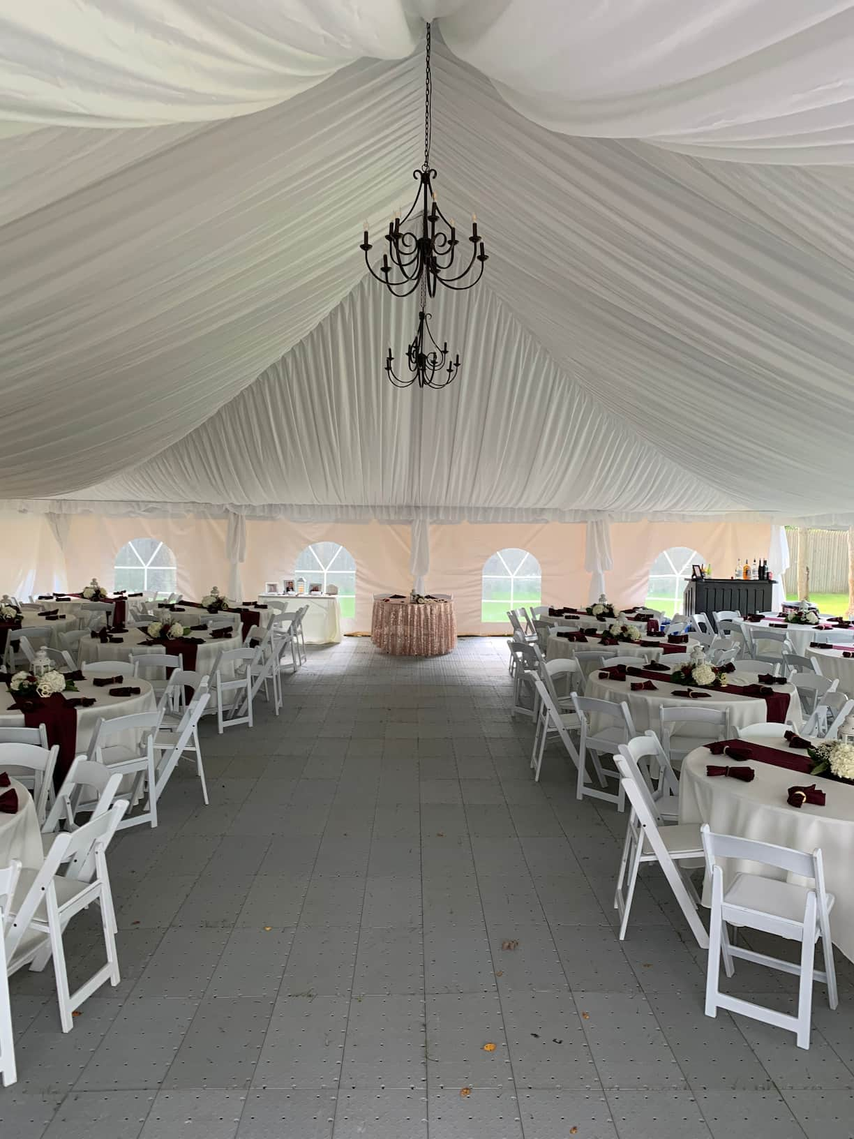 A wedding reception set up under a tent