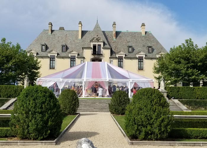 A wedding tent infront of an estate