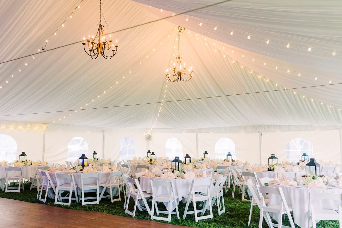 rustic chandeliers hanging in a tent