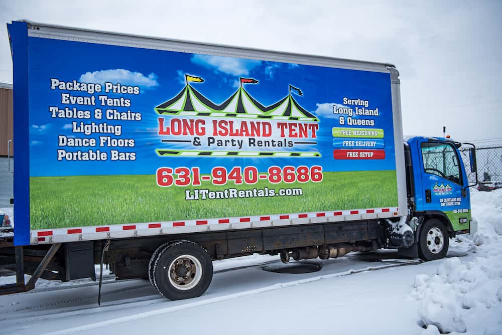 a truck with Long Island Tent graphic