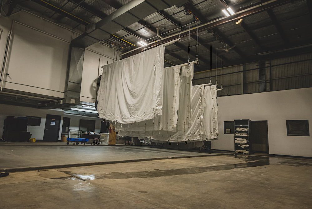 Wedding tents hanging up in a warehouse