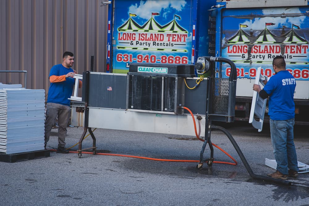 Workers using a chair cleaning machine