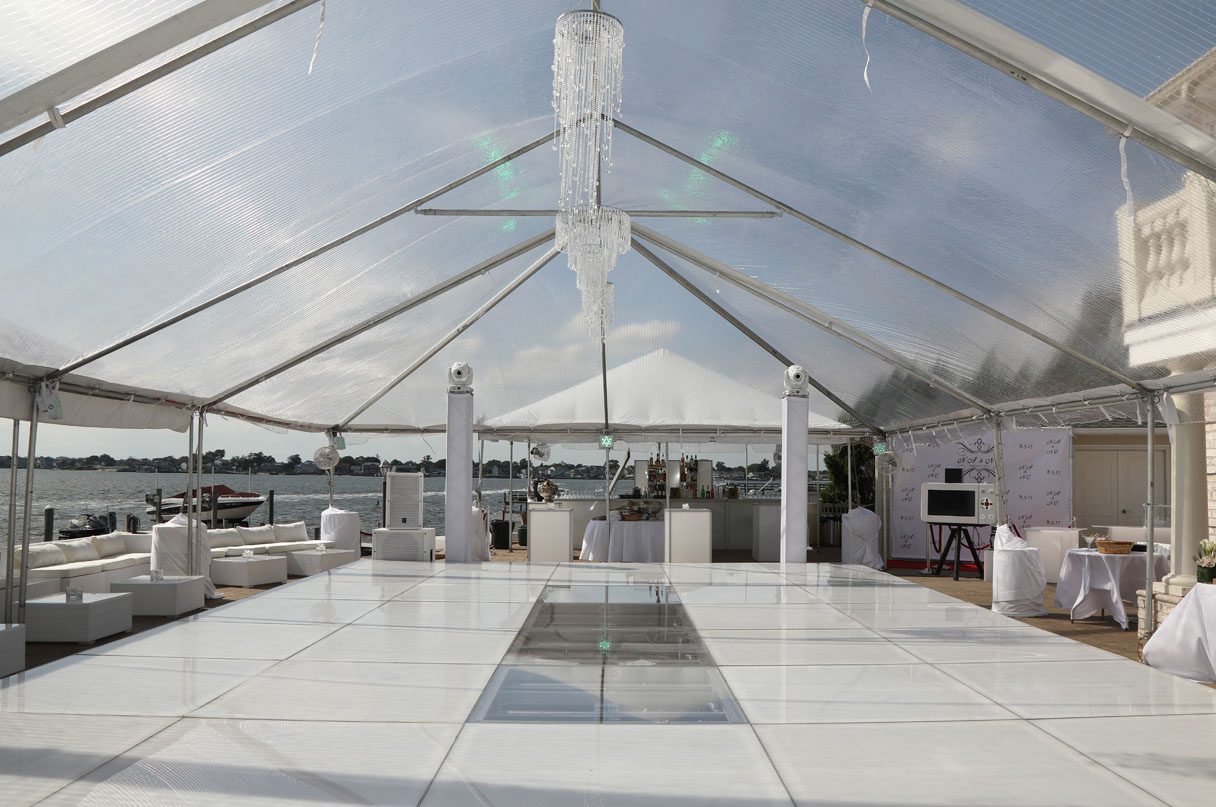 A clear top tent over a wedding reception