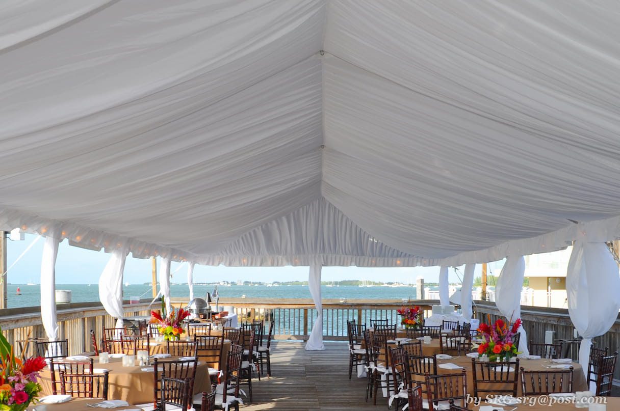 A tent over a wedding reception area