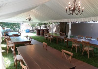 an outdoor reception area, with wooden tables